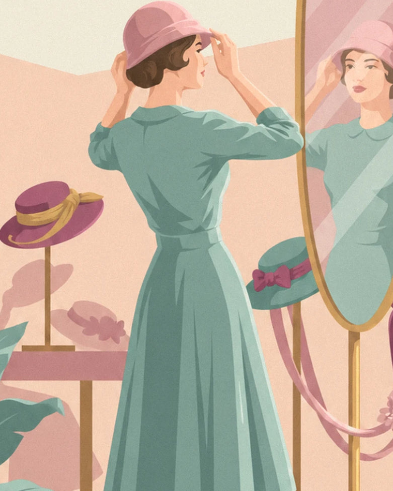 A woman in a green dress adjusting her pink hat in front of the milliner’s mirror