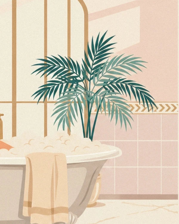 The green palm beside the bath, with a beige towel over the edge and pink tiles
