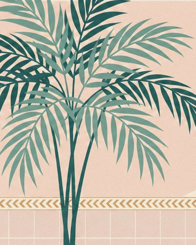 The palm tree with deep green and pale green leaves, in front of the pink wall and its golden frieze