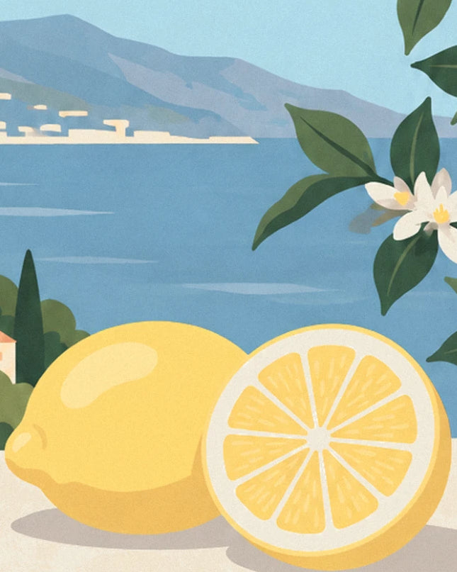 A whole lemon and a lemon half beside the water, with white lemon blossom at the top right