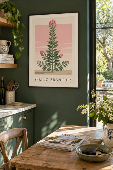 Poster of leafy branches and pink spring flowers: framed on the wall