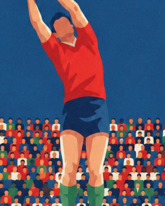 The jumper in a red shirt and blue shorts, arms stretched towards the sky in front of the stands