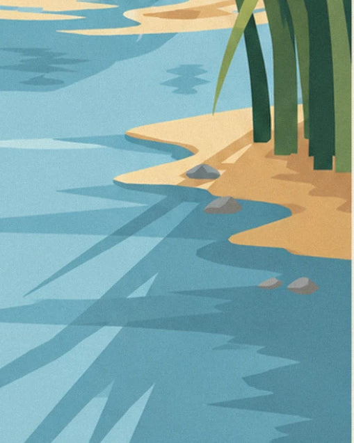 Un îlot de sable doré avec ses roseaux verts et 4 petits galets gris, au bord de l'eau bleue