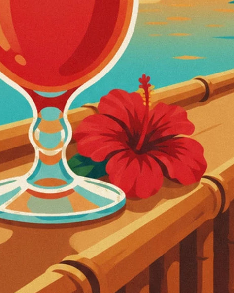 The base of the glass and a red hibiscus on the beach bar’s bamboo counter