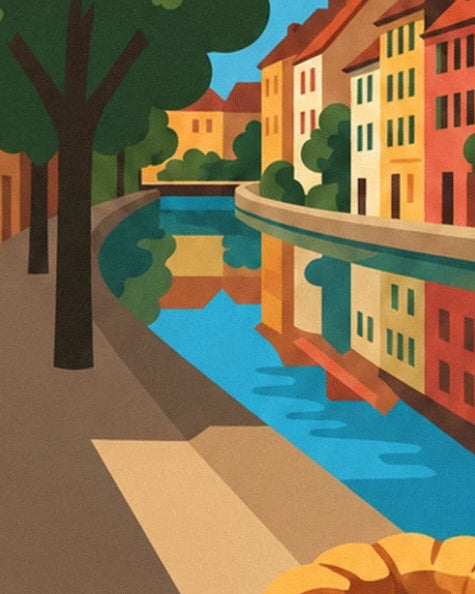 The colourful façades of Colmar reflected in the tree-lined canal
