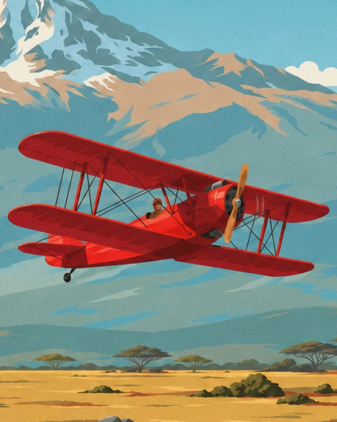 The red biplane and its pilot in front of the snow-covered slopes of Kilimandjaro