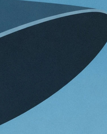The curve of the hat's midnight blue brim, edged with a light blue ribbon