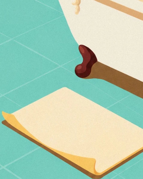 Le tapis de bain crème sur le carrelage turquoise, près du pied de la baignoire
