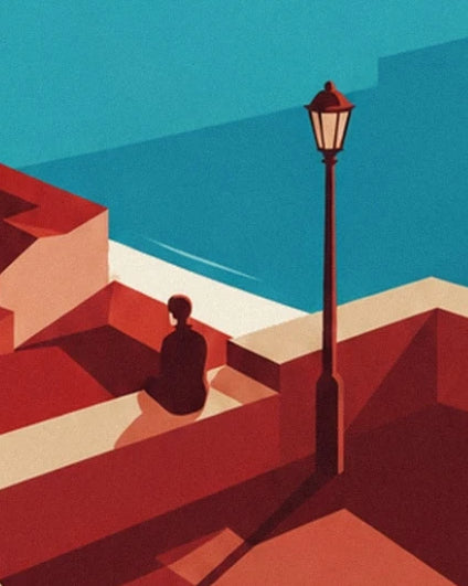 A figure sitting facing the turquoise water, near a street lamp on the red rooftops