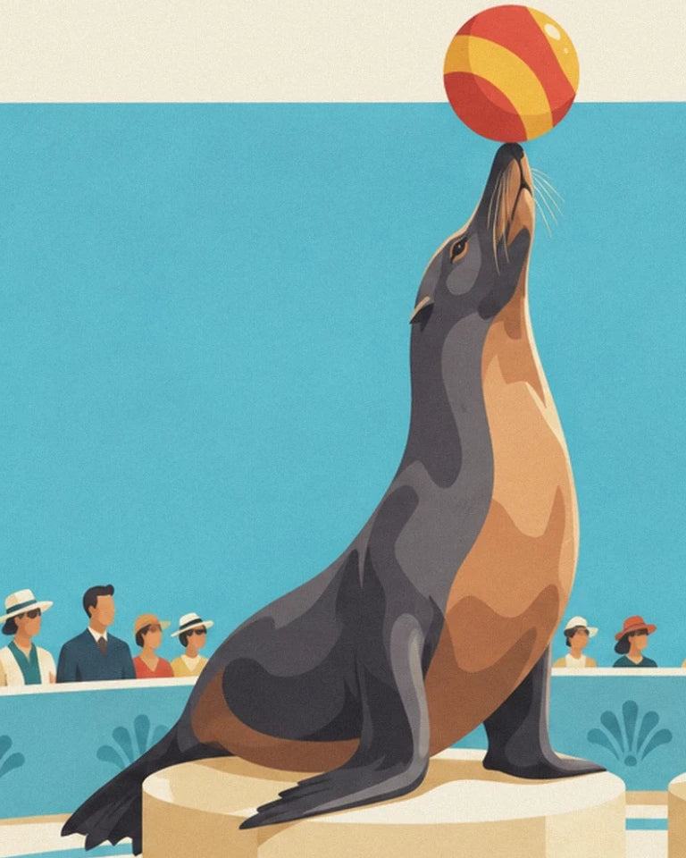 Sea lion on its plinth, balancing a red and yellow ball on its nose