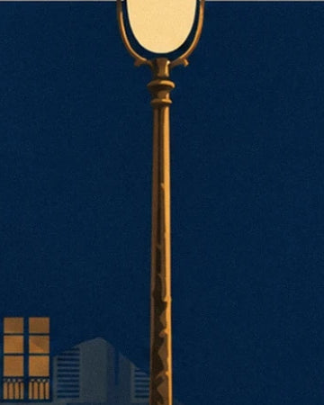 The golden street lamp against a midnight blue background, near lit windows