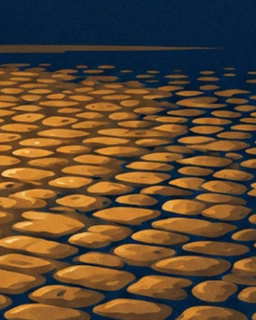 Cobbles with golden reflections and midnight blue shadows along the street