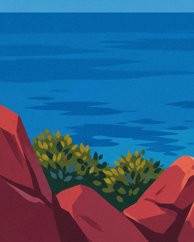 The deep blue sea seen from the red rocks, with 2 clumps of green bushes