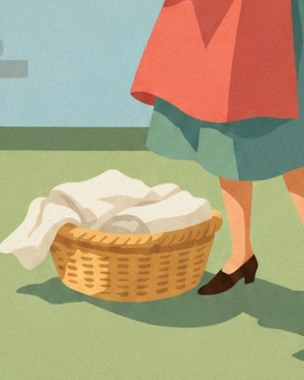 The golden wicker basket filled with white laundry on the grass at the feet of the housewife in brown court shoes