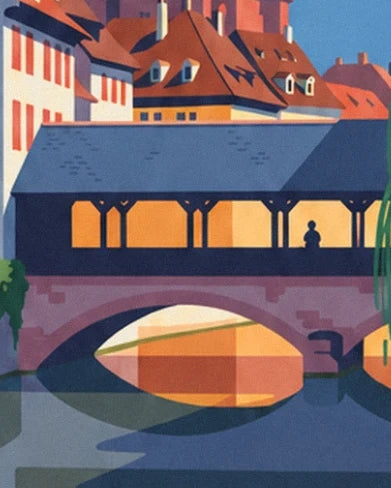 The covered bridge with its slate blue roof, its outline and arch above the water