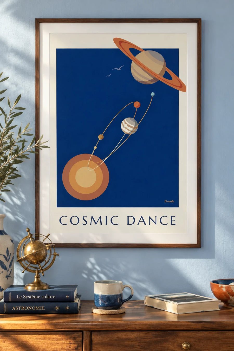 Poster of Saturn and planets orbiting the Sun on a midnight blue background: framed on the wall