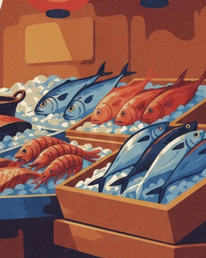 The blue and red fish and prawns on ice in the wooden crates