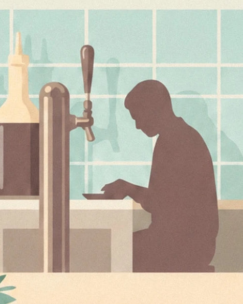 A silhouette seated at the diner counter beside a drinks tap and pale aqua tiles