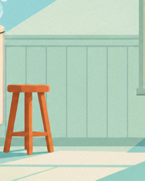 The orange wooden stool in front of pale aqua panelling, near the machine