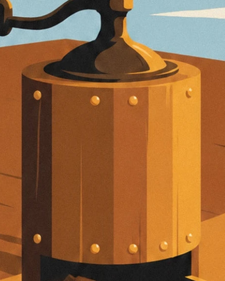 The golden wooden body of the coffee grinder, its round rivets and black handle