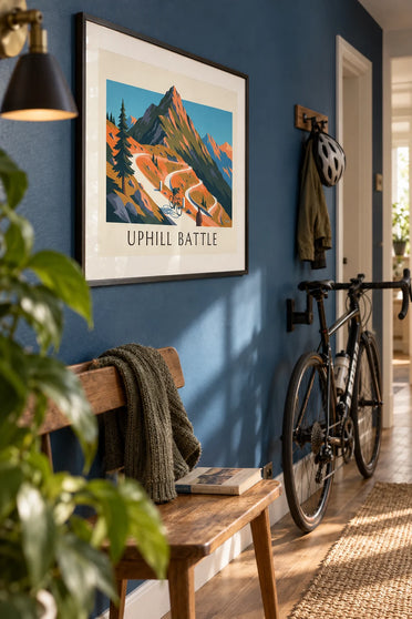 Poster of a cyclist on a mountain pass with tight hairpin bends: framed on the wall