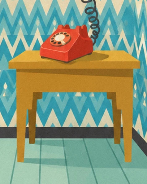 The red rotary telephone on its mustard-yellow hallway table