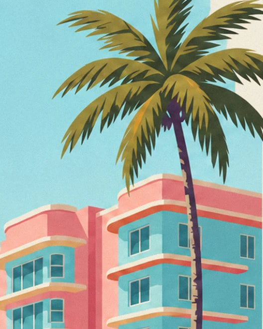 A tall leaning palm tree in front of the pink and turquoise Art Deco façade, beneath a pale blue sky