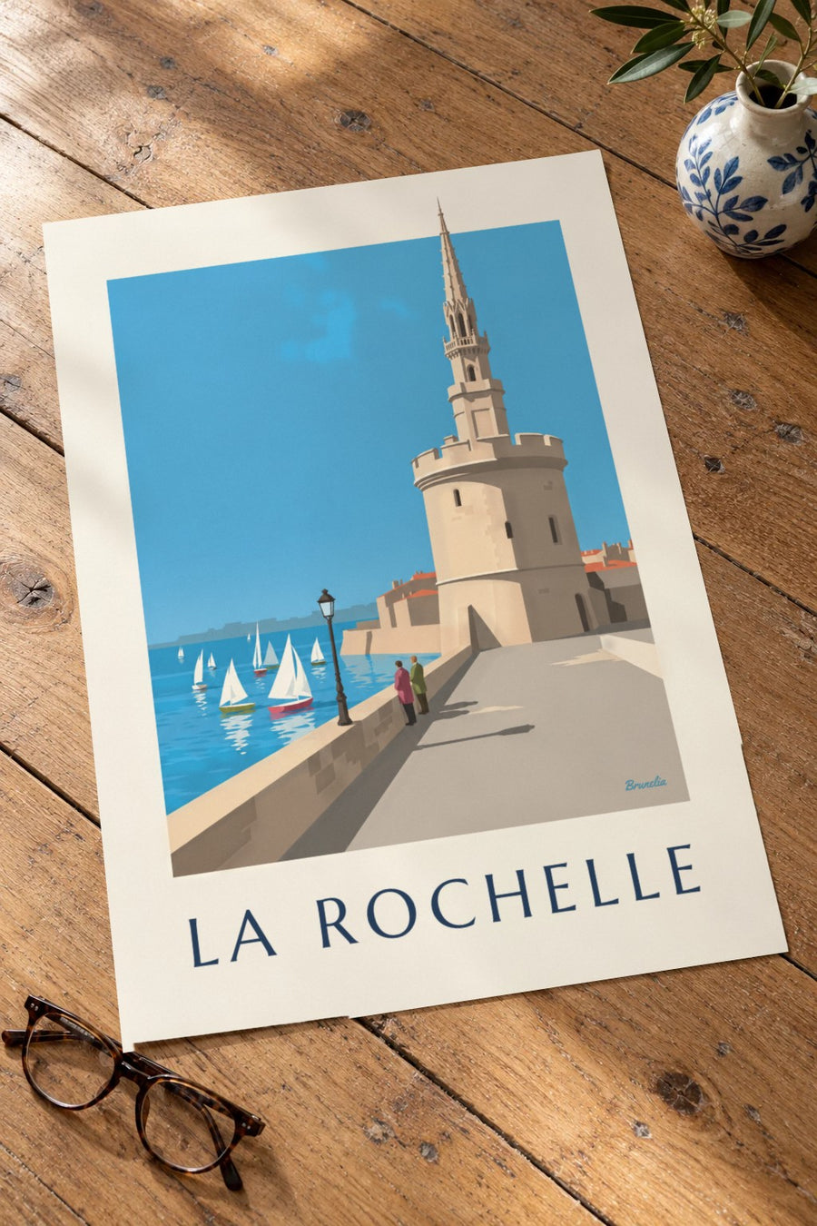 Plakát Věže lucerny v La Rochelle : położený na stole