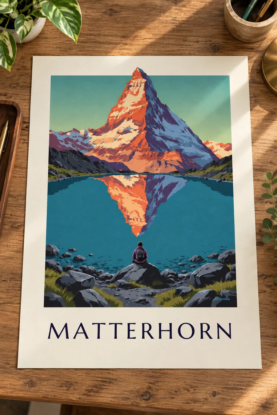 Plakát Matterhorn při západu slunce odrážející se v alpském jezeře: plakát položený na stole