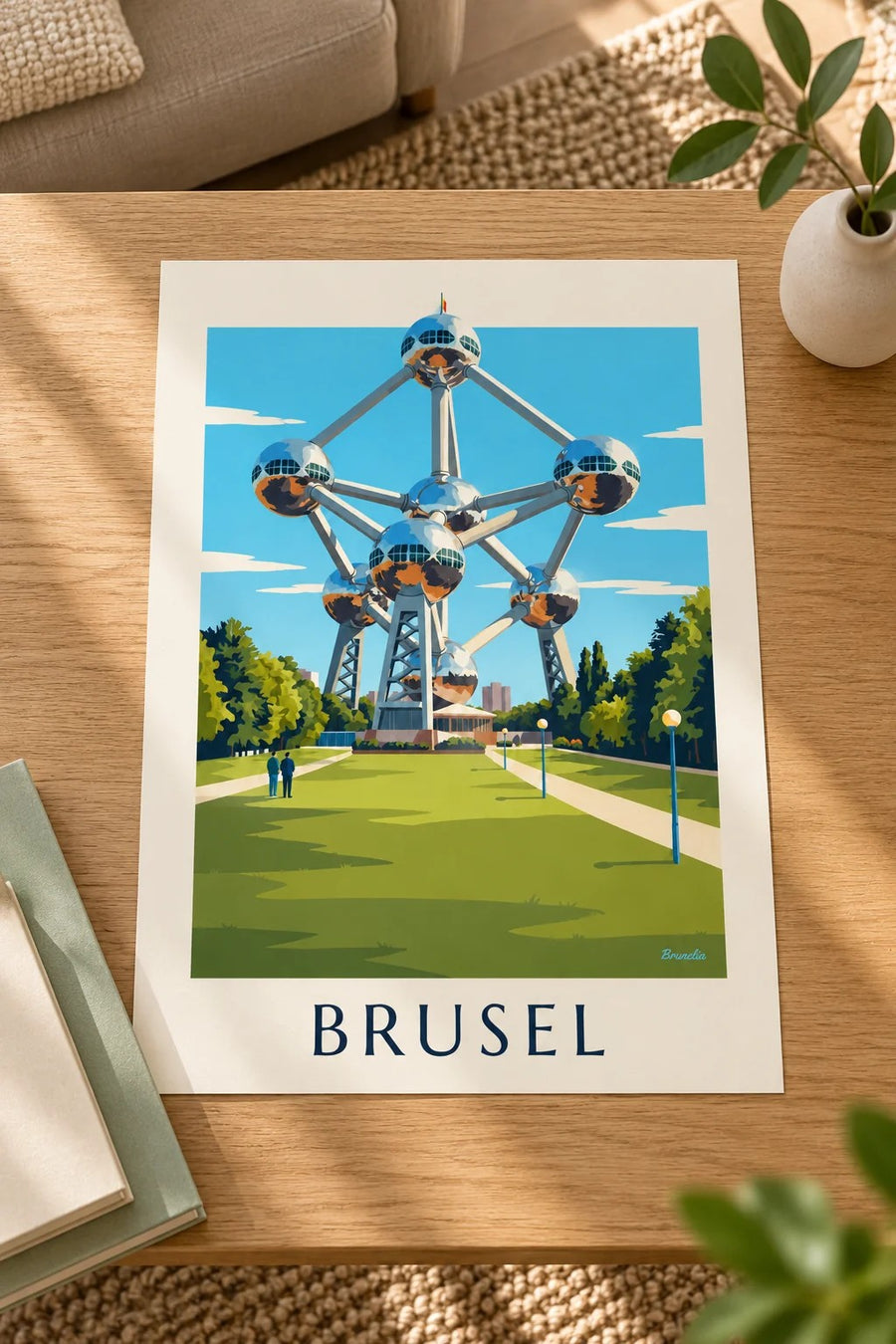 Plakát Atomium v Bruselu a trávníky parku: položený na stole