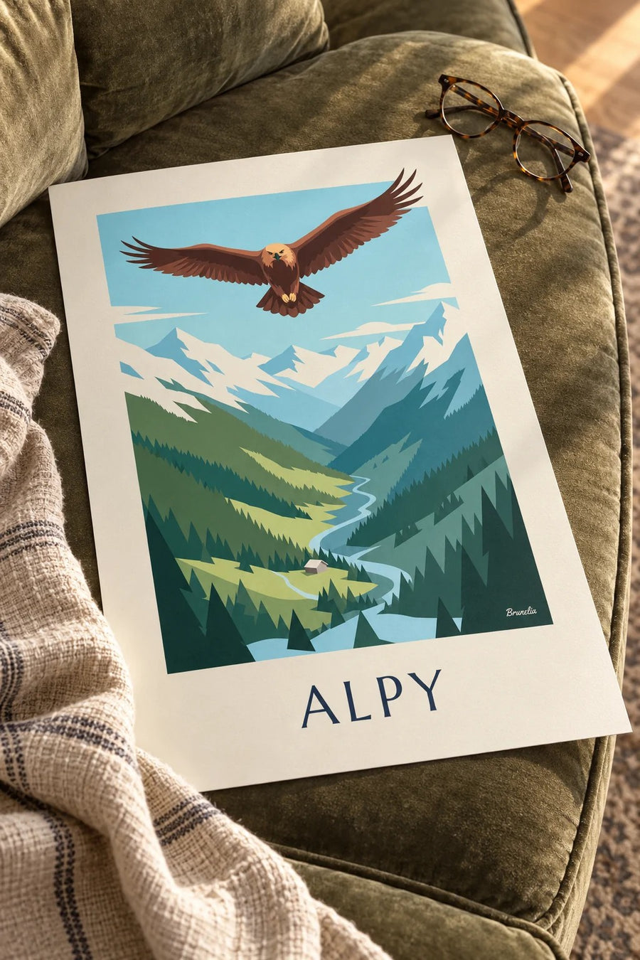 Plakát orel skalní nad alpským údolím: položený na stole