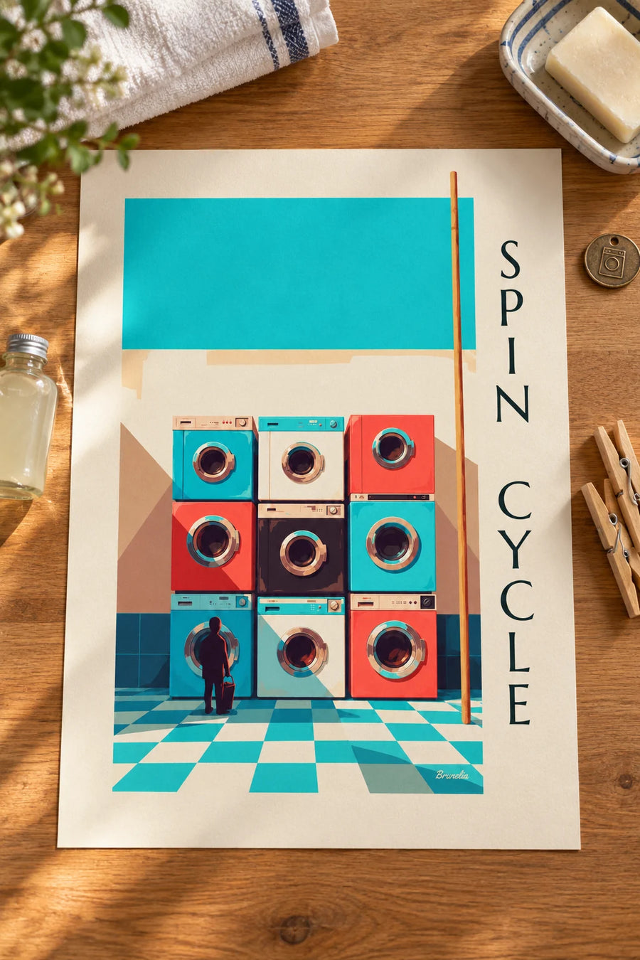 Affiche grille de 9 machines à laver colorées : posée sur une table