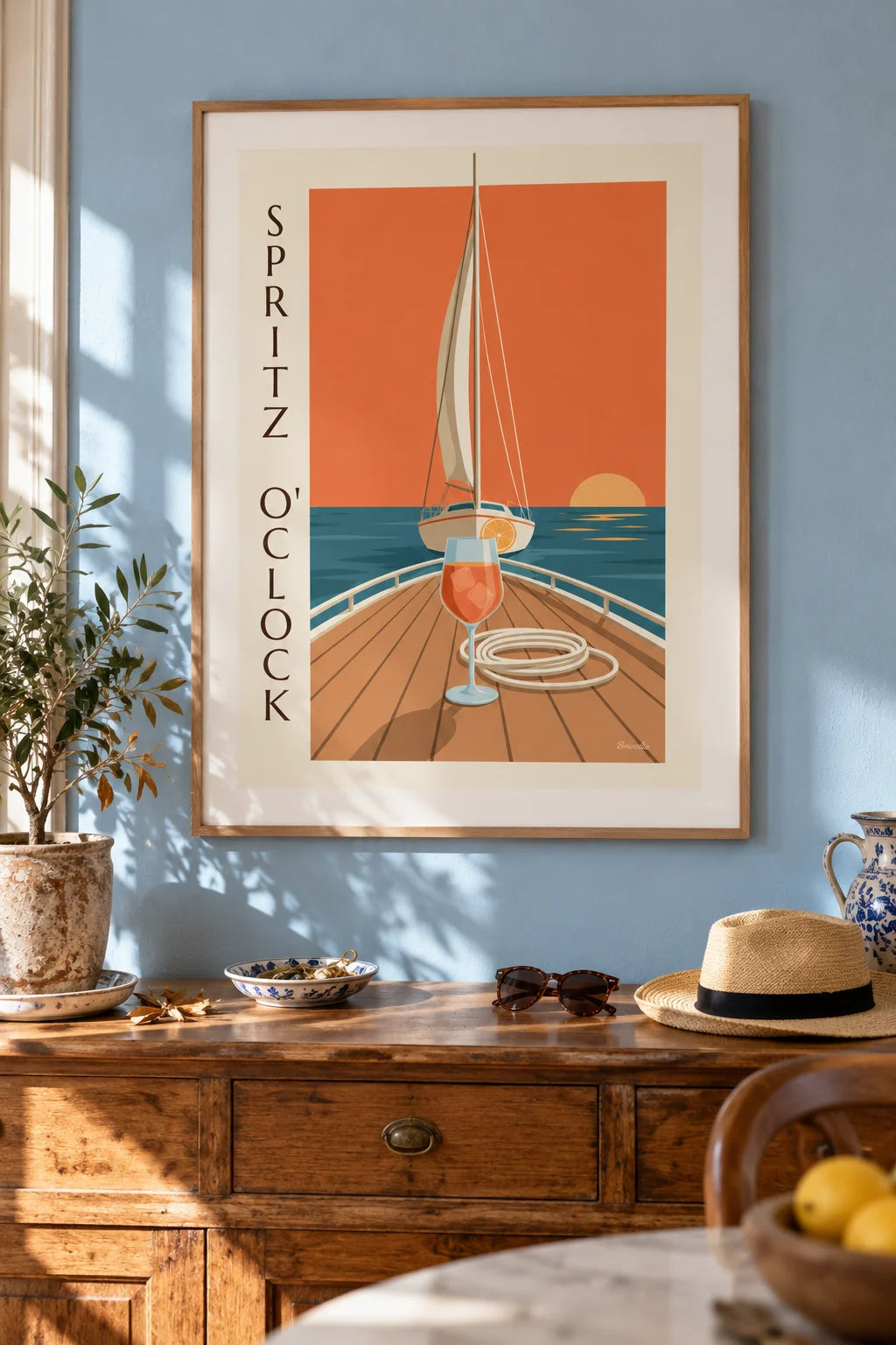 Mise en situation de Affiche spritz sur le pont d'un voilier au coucher du soleil