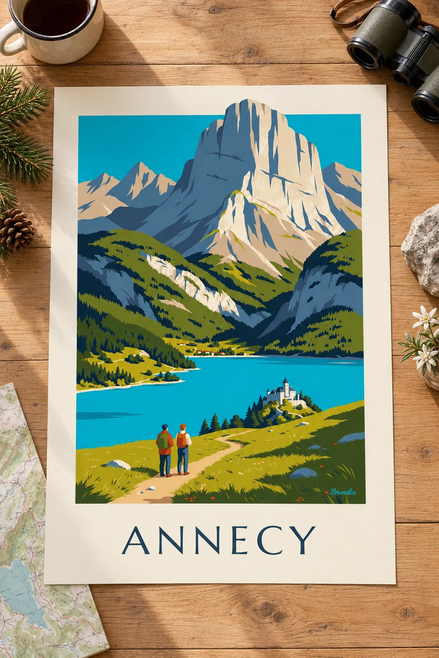 Plakát túry nad jezerem Annecy: plakát položený na stole