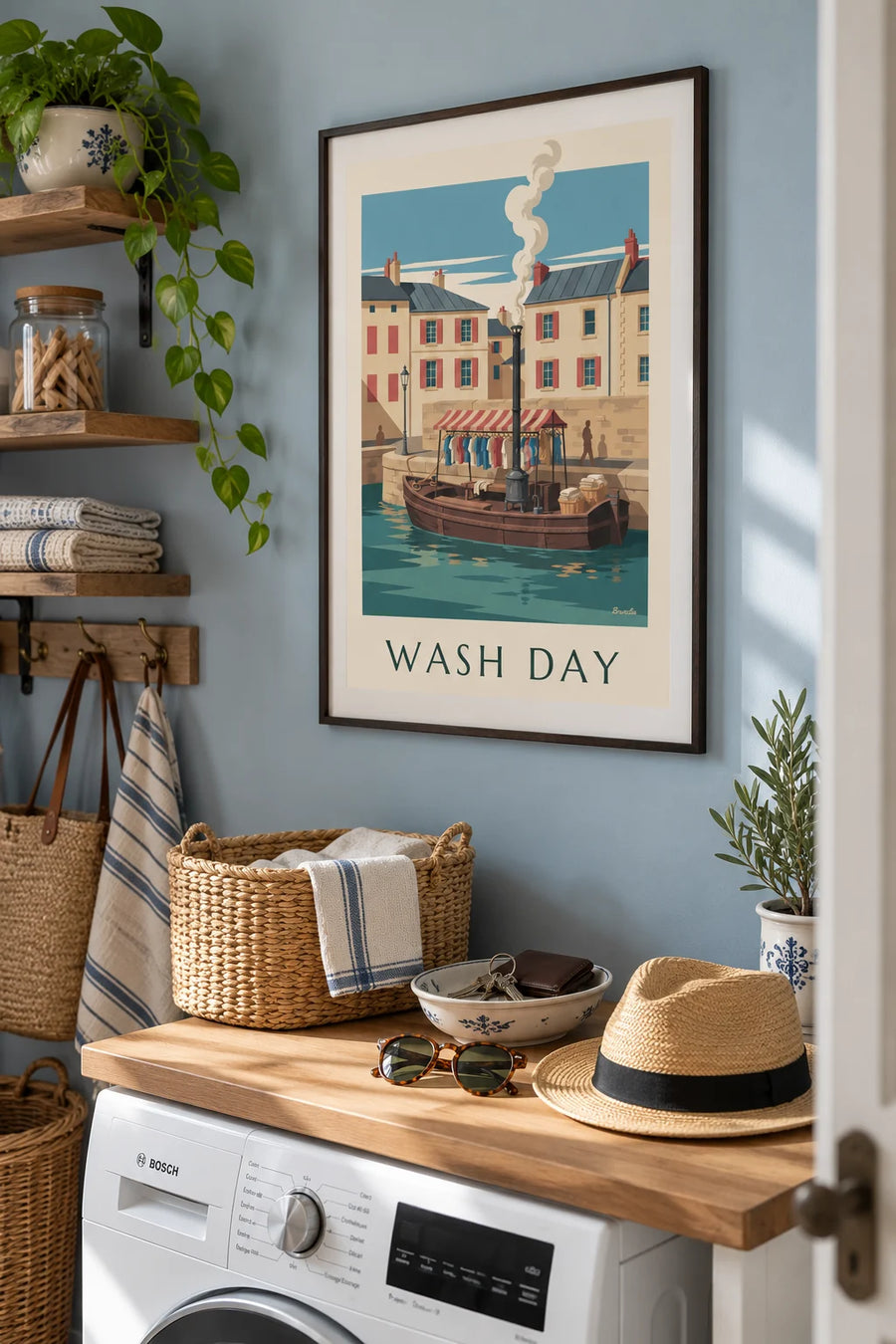 Poster of a wash boat moored at the quay, shirts hanging under the awning: framed on the wall