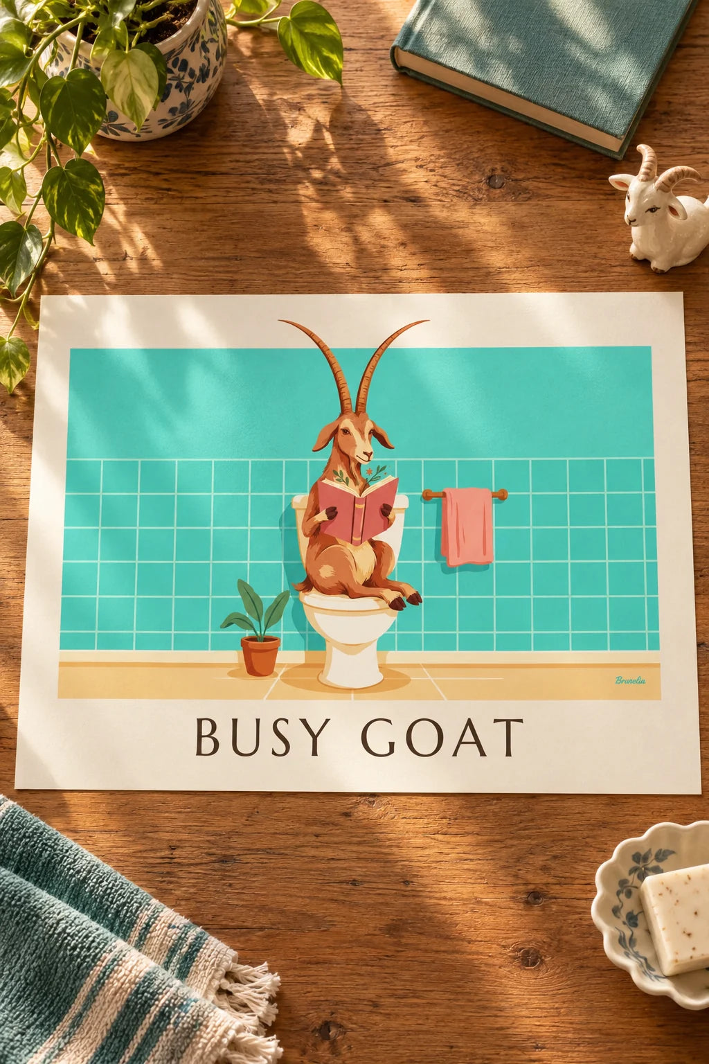 Powder room: Funny goat reading on the toilet poster on the wall