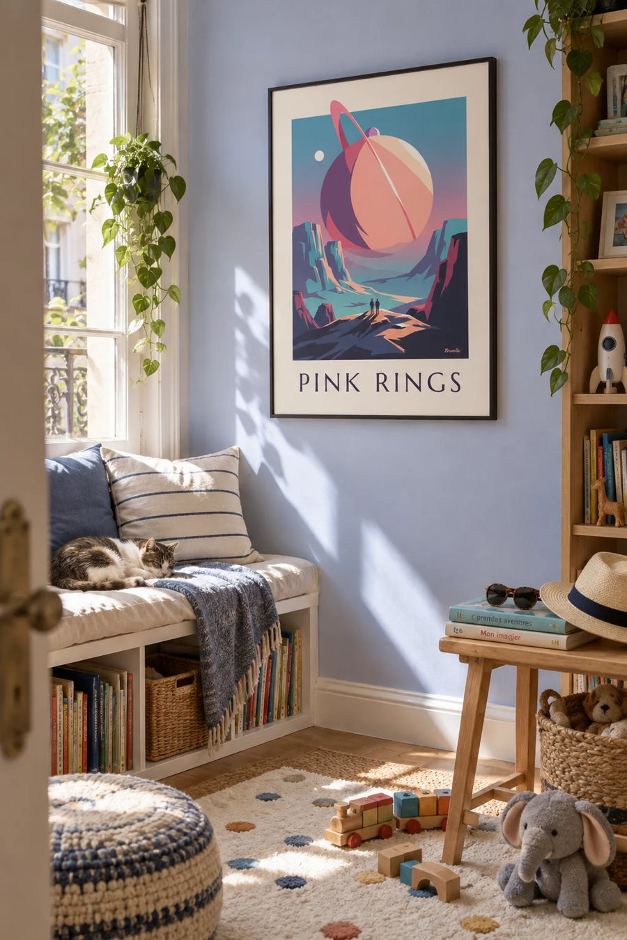 Poster of a planet with pink rings over an alien landscape: framed on the wall