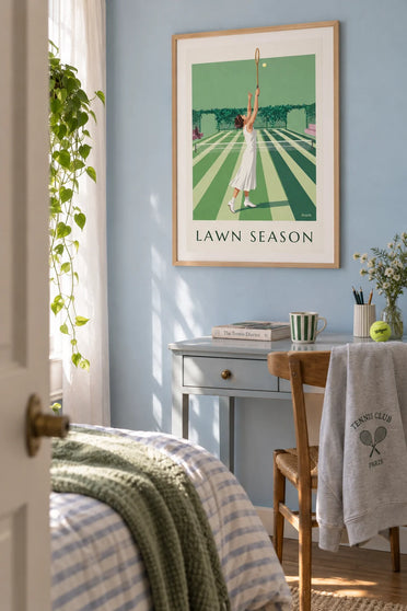 Poster of a tennis player serving on a grass court: framed on the wall