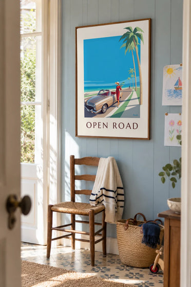 Poster of an elegant woman and a convertible car by the sea: framed on the wall