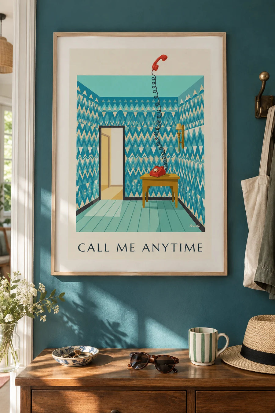 Poster of a rotary dial telephone on an entryway table: framed on the wall